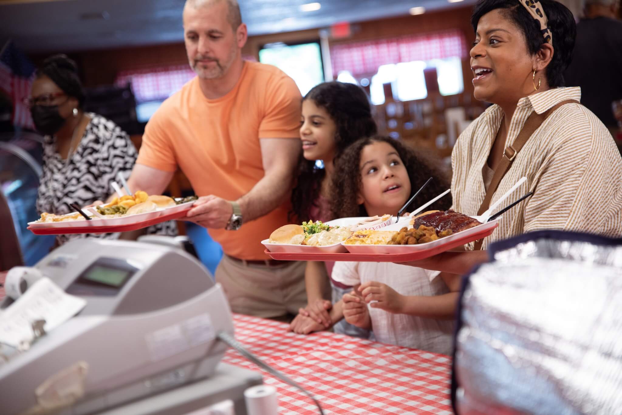 photo of family ordering food at Midway BBQ in Union County