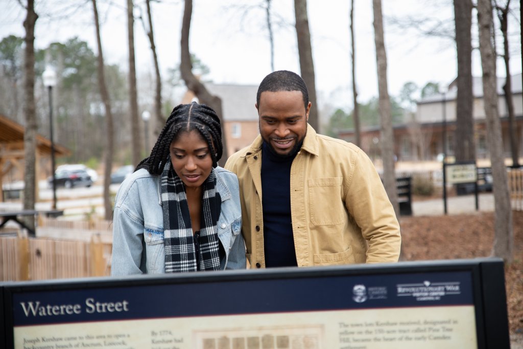 photo of couple reading sign at Historic Camden campus