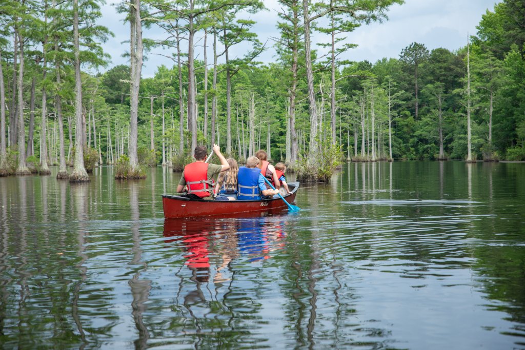 photo of family paddling at Goodale State Park, one of the 9 state parks in the Olde English District